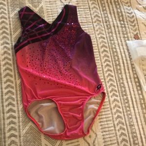 GK Elite leotard. Child Large. Pink & Purple ombré and black. Bling. Used.
